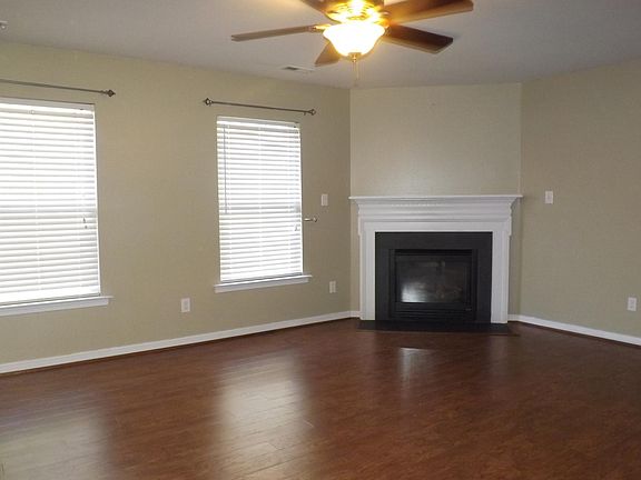 Family Room has a corner gas fireplace with beautiful mantel & surround.