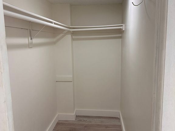 Master bedroom closet, new moulding, light fixtures, floor and new paint.
