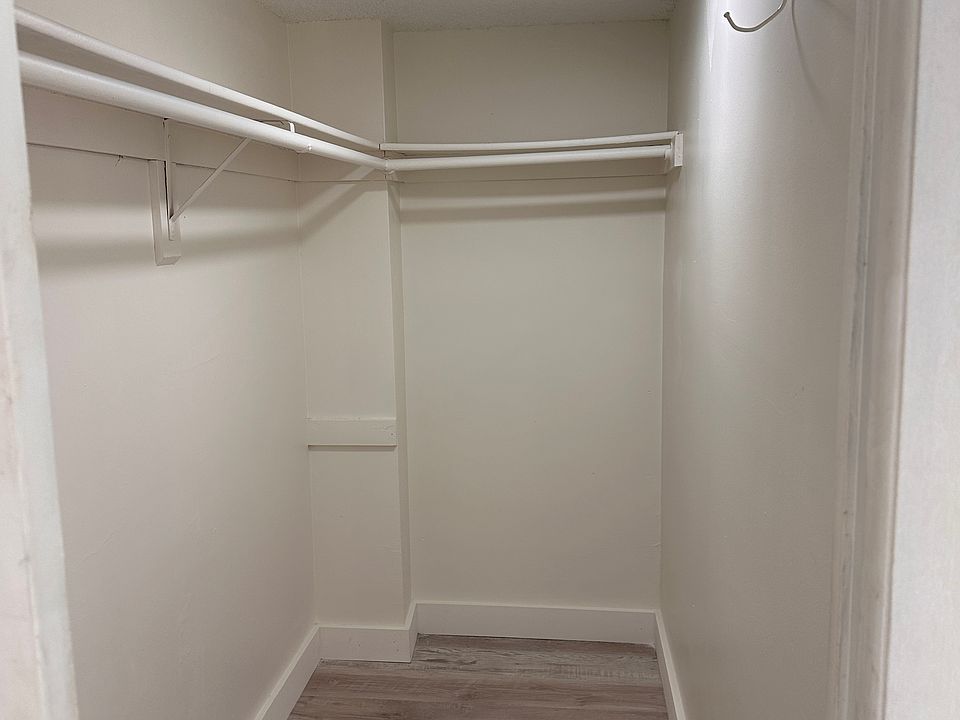 Master bedroom closet, new moulding, light fixtures, floor and new paint.