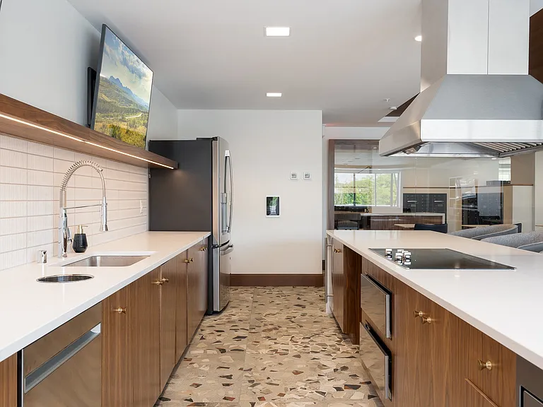 Our expansive clubroom includes a full chef's kitchen and walkout patio.
