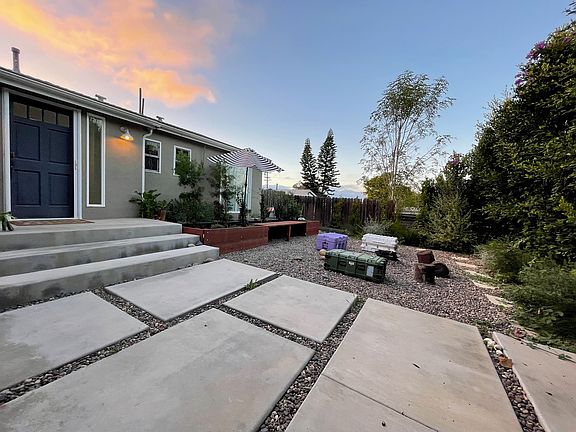 View once you enter the outer gate. Very large front yard with lush garden for privacy + balcony access from second en suite