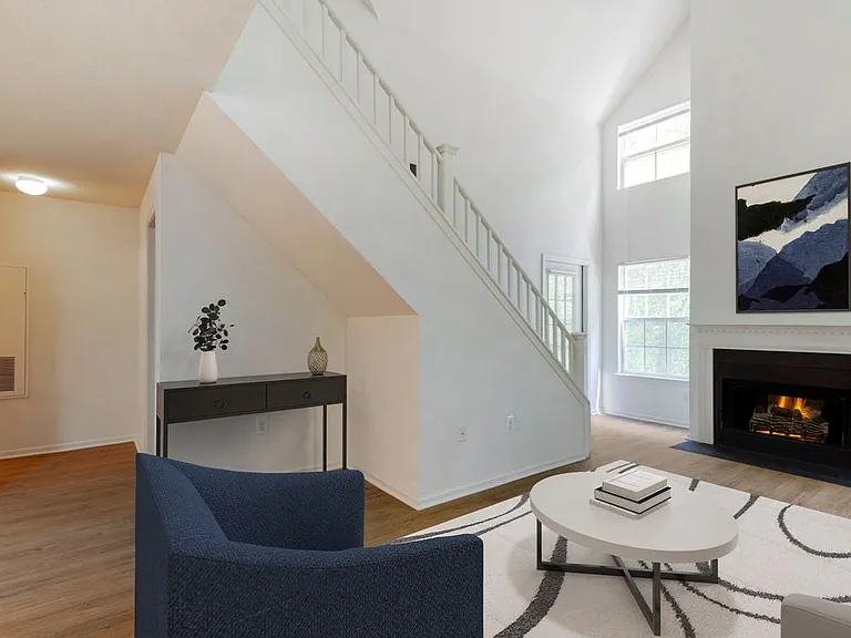 Renovated Package I living room with hard surface flooring. Lofts in select homes.