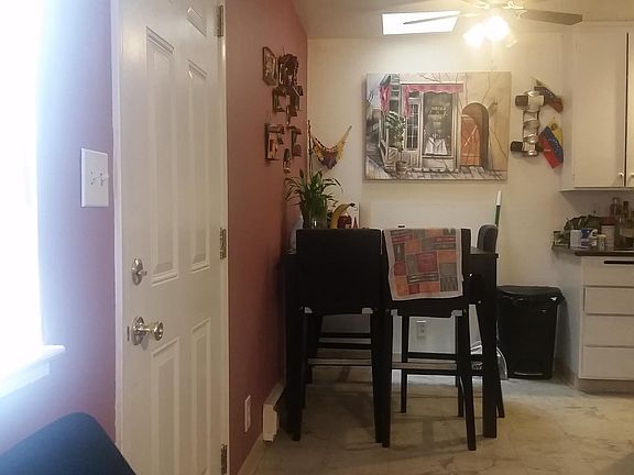 Dining area under fan and light. Enjoy home-cooked meals
