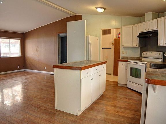 Kitchen looking to living room
