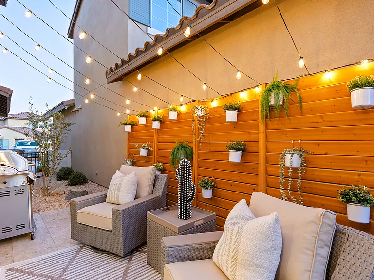 Side Patio features an illuminated space and natural gas BBQ Grill!