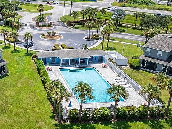 Aerial view of the community pool. There's anle room for sunbathing and visiting with friends and family poolside.