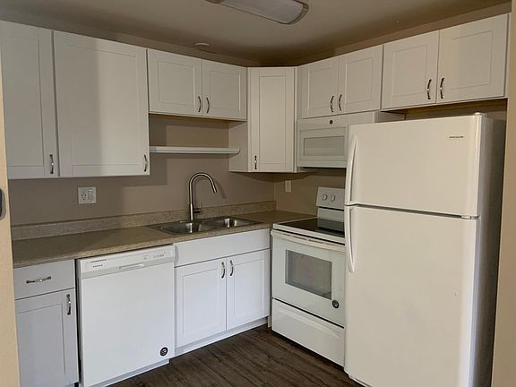 Beautiful white cabinets provide plenty of storage. Has great appliances including convection top range and built in microwave. Roomy countertop space, good size double sink and upgraded spray wand faucet will make cooking preparation and clean up easie