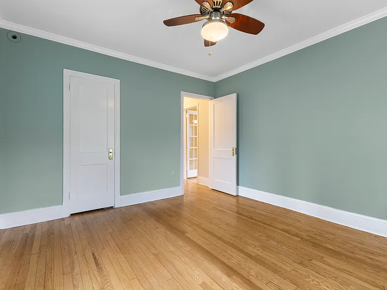 Versatile bedroom upstairs with pristine hardwood floors