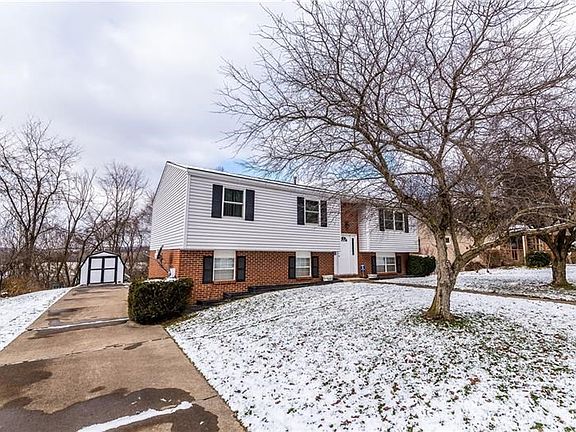 The side driveway leads to the garages in the rear of the house.