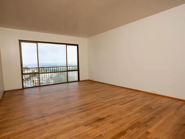 The primary bedroom has a view of Golden Gate Park and the Golden Gate Bridge
