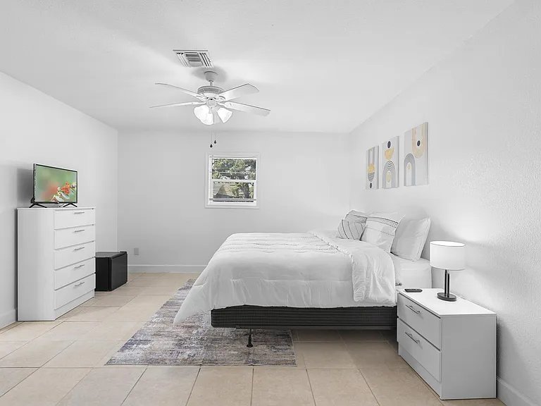 Spacious double-occupancy king suite with TV, dresser & desk Sanford, FL