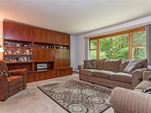 Living offers a spacious area. Note, the wall unit w/built-in bar area is not attached (negotiable i