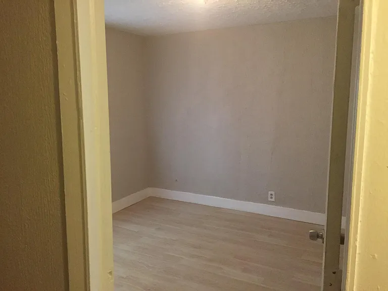 1st bedroom near the entrance with windows to street