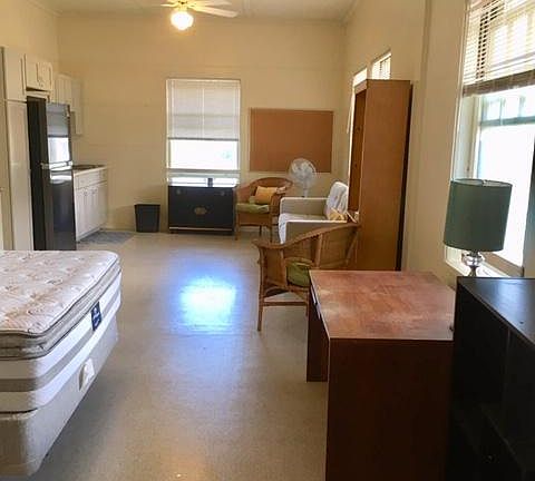 View from Bath and closet. Light and bright, cool side of mansion. New Queen bed and almost new couch and two rattan chairs and bookcase included.