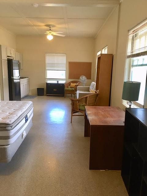 View from Bath and closet. Light and bright, cool side of mansion. New Queen bed and almost new couch and two rattan chairs and bookcase included.
