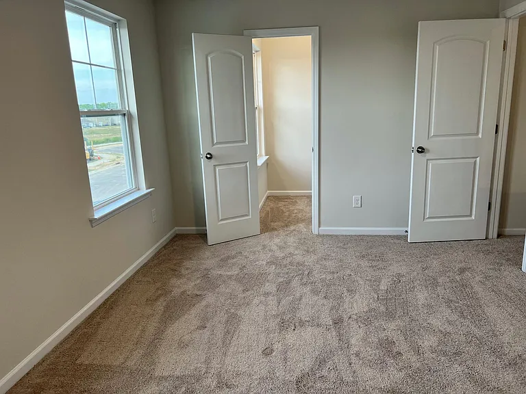 First bedroom with walk-in closet