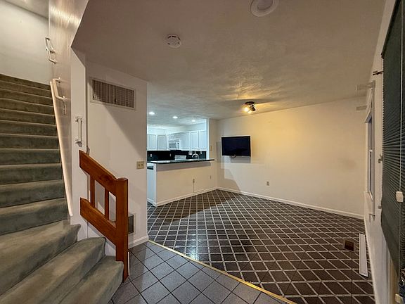 2 level townhome with a 3rd level loft! Open concept into kitchen.