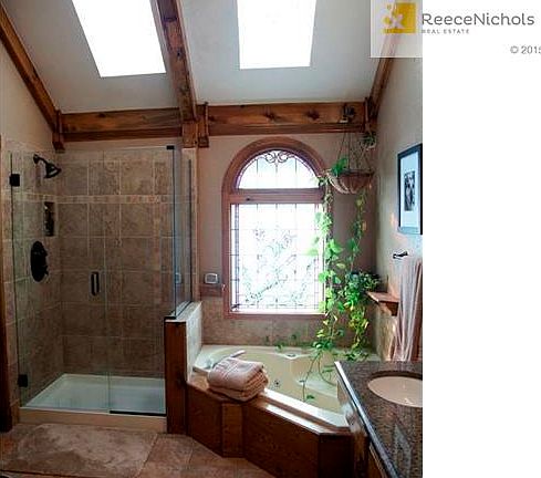 Master Bath with Jetted Tub, Stand Alone Shower, and Granite Vanity