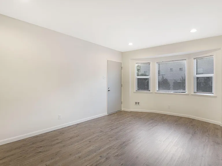 front door entry to living room with new recessed lighting