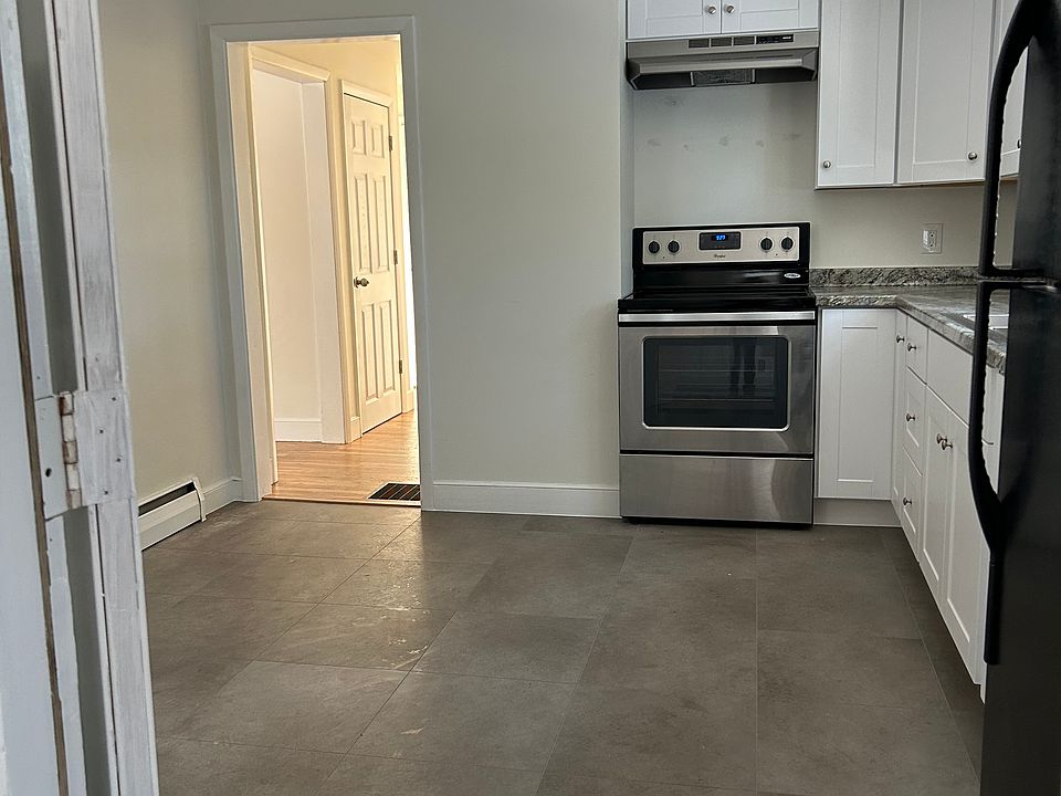 Kitchen features new floors, cabinets, and countertops, offering a fresh and inviting space