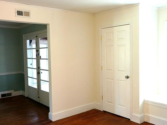 Doors leading to sunroom from dining room