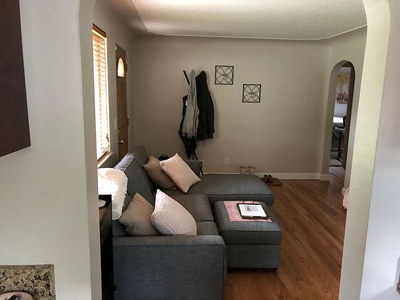 Front door and living room view from the kitchen