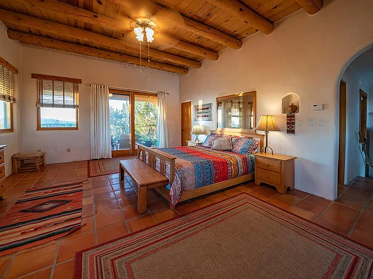 Vigas and saltillo tiles in Master bedroom