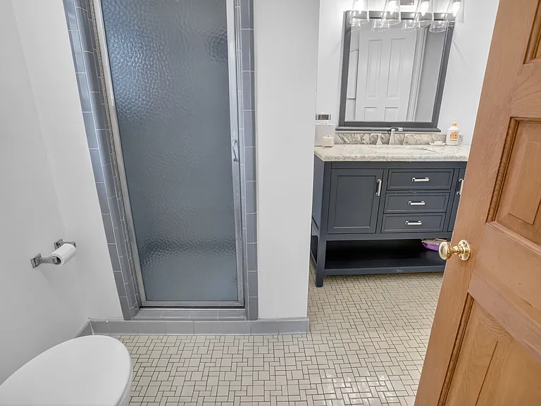 Main level full bathroom from den or hall.