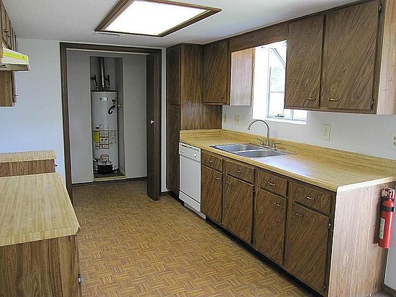 Kitchen and laundry area.  Fairly new water heater in this house.