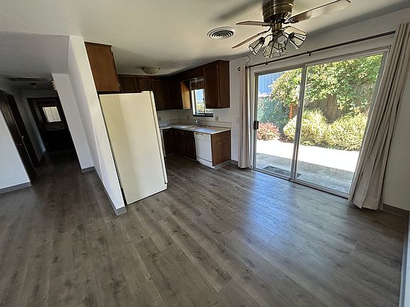 Looking at Kitchen and down hallway from dining area
