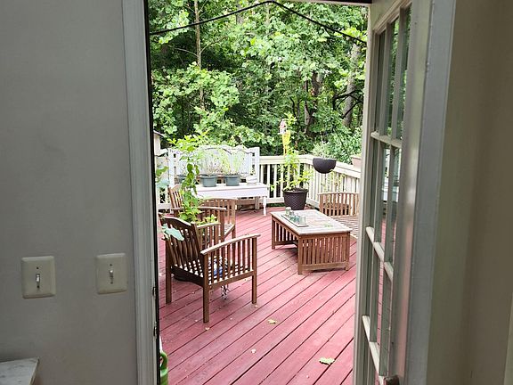 Door from Sunroom at leads to Back Deck.