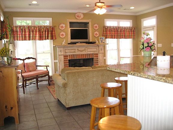 Hearth room off kitchen is airy and bright for family entertaining.