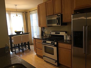 Sunny kitchen with eat-in kitchen and downtown views