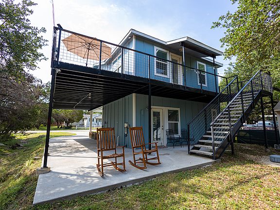 View of Back of the house. Stairs lead to the main living area upstairs