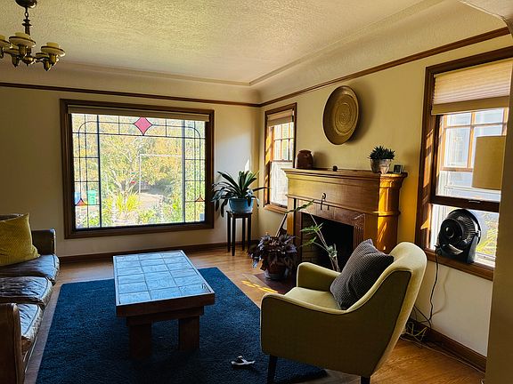Living room with wood burning fireplace