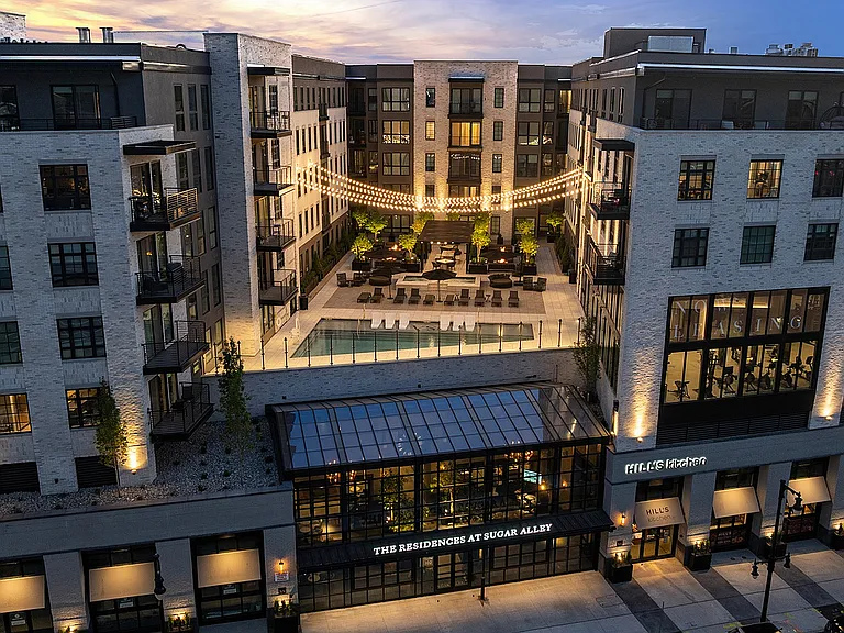 Front of Sugar Alley with rooftop pool deck in view