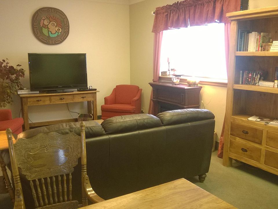 The leather couch has been replaced with a loveseat.