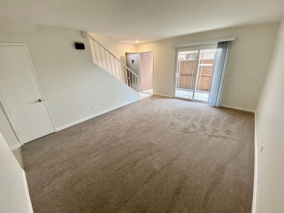 Living room, under stairs closet/storage