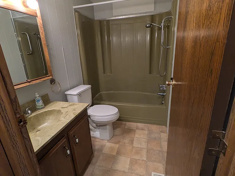 secondary bathroom with tub.