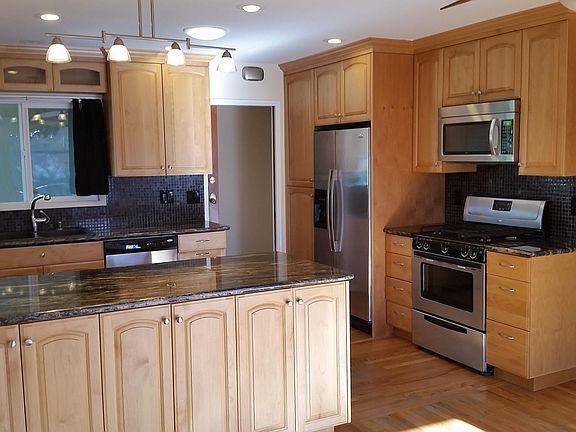 Nice open kitchen with plenty of storage space and granite counter tops. Stainless steel appliances.