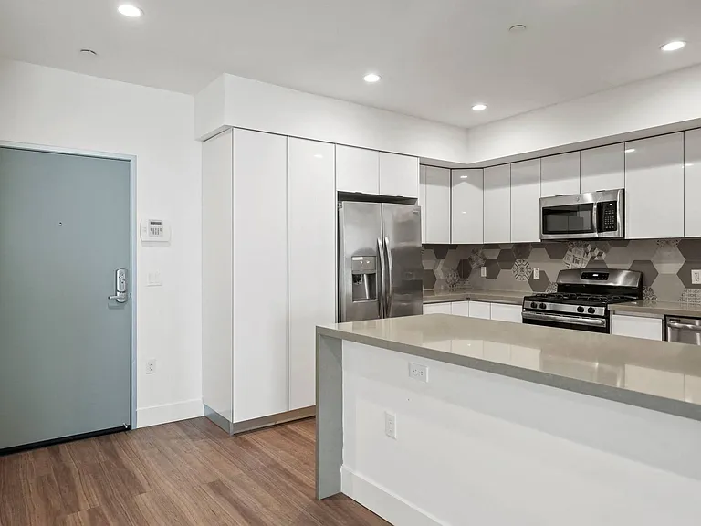 Front Entry of Apartment and Kitchen