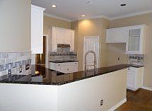 Renovated kitchen is the heart of the home w. view to backyard.
