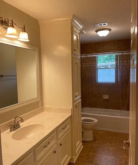2nd bathroom with tub/shower combination and plenty of storage.