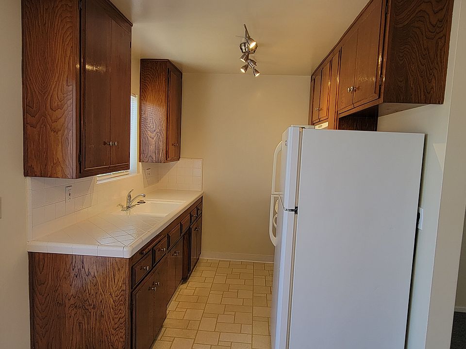 Kitchen with refrigerator and range