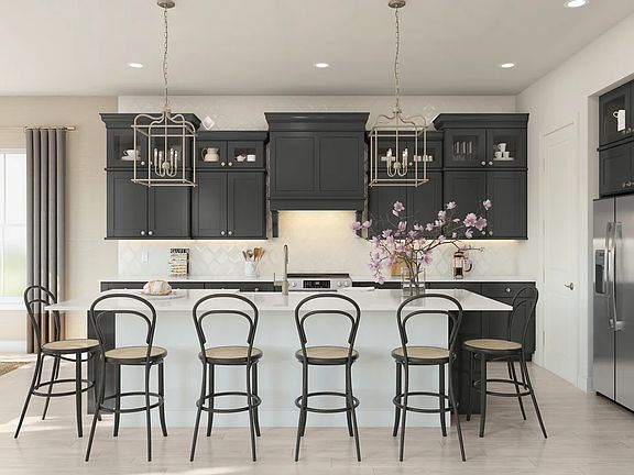 Kitchen with glass upper cabinets and pendant lighting