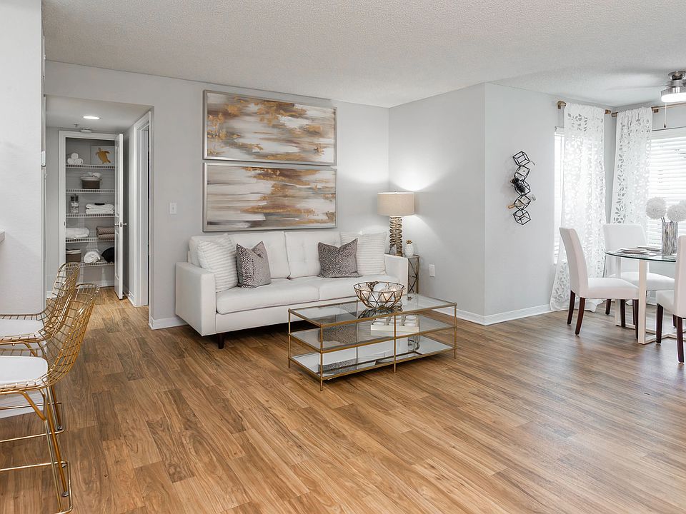 This open-concept layout features a cozy living room, sunlit dining nook, and a stylish breakfast bar.