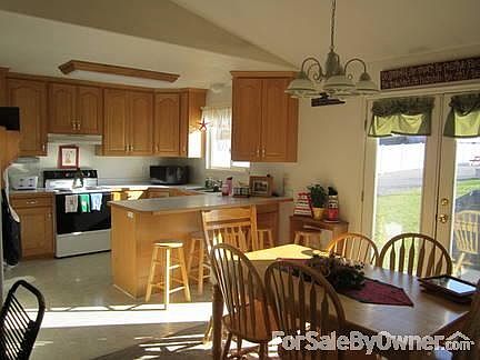 Bright Kitchen and Dining Area
						:
						vaulted ceiling
