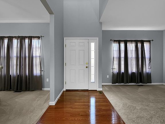 Hardwood Entry Foyer with a 2 story Ceiling Height