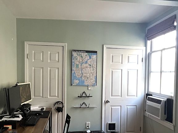 Second room used as livingroom/office space. Doors are closet space