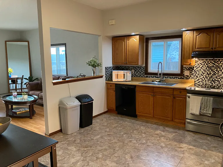Kitchen leading into common space (living room)
